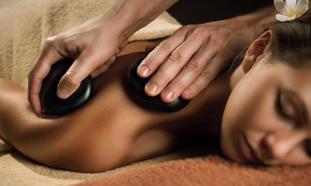 Ease tense muscles with a hot stone massage